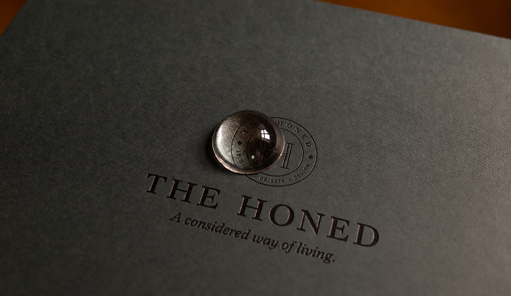 The Honed seal and wordmark embossed into a leather sample